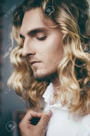 Maybe you would like to learn more about one of these? Close Up Portrait Of A Handsome Young Man With Long Curly Blond Stock Photo Picture And Royalty Free Image Image 91028216