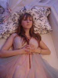 woman on her deathbed at a fantasy funeral