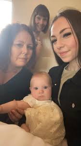 Unfortunately, my sister got cut out of this family photo at the Popcorn  Fest. But fortunately, a woman we didn't initially notice took her place  with this cute photo-bomb behind us. If