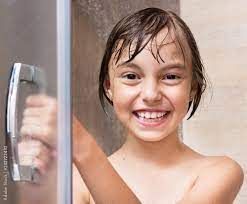 Cheerful beautiful girl bathing under a shower at home. Happy little girl  washing head in shower in the bathroom - close up portrait фотография Stock  | Adobe Stock