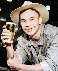 27-year-old future heavyweight champion Rocky Marciano eats a bowl of pasta  and a chunk of bread served by his mother, Pasqualina Picciuto Marchegiano,  at home in 1950.