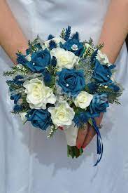 Use january's birth flower as a great excuse to create silk bouquets full of beautiful carnations. Romantic Scottish Inspired Artificial Teal Rose Thistle And Heather Wedding Bridal Bouquet Blue Roses Wedding Teal Wedding Flowers Bridal Bouquet