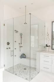 River rock tiles work on either floors or walls. White And Gray River Rock Shower Floor Tiles Transitional Bathroom