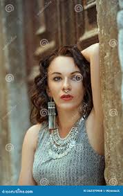 Caucasian Brunette Woman with a Septum Piercing Wearing a Grey Dress and  Silver Jewelry Stock Photo - Image of germany, style: 262379948
