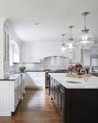 White Cabinets With Black Island Transitional Kitchen Benjamin Moore White Dove Black Kitchen Countertops White Kitchen Design Kitchen Design