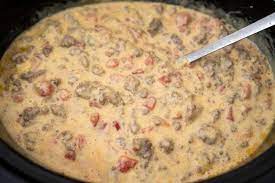 Put the hob on a low heat and return the hamburger and sausage meat to the pan. Crock Pot Queso With Beef Sausage