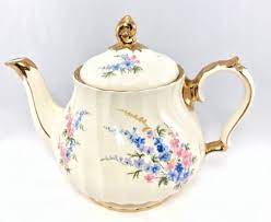 It stands 4.75 inches tall (12 cm), 7 inches long (18 cm), and 4.5 inches wide(11.5). Vintage Antique Sadler Teapot Blue Pink Flowers 22 Kt Gold Trim England Poterie Ceramique Porcelaine
