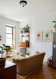 How To Make Your Living Room Look 10 Times Bigger In 10 Minutes Or Less Small Apartment Living Livingroom Layout Apartment Living