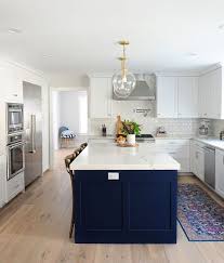 navy and white kitchen // gold and