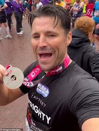 Mark Wright completes the London Marathon alongside his brother Josh
