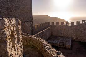The castle of sesimbra, a fishing village south of lisbon, the oldest fortress of sesimbra, was built on top of a hill, north of the village, dominating the whole bay. Empty Beaches And A Castle In Sesimbra Portugal Steemit