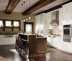 This is also reflected in the design of the kitchen cabinetry through the use of woods which have natural imperfections such as burls, knots, bird pecks, worm holes and pits. Quartersawn Oak Cabinets In Rustic Kitchen Decora