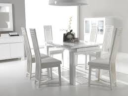 white chairs at simple wood table in