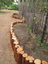 Hide the trap with vegetation. 17 Fascinating Wooden Garden Edging Ideas You Must See The Art In Life Wooden Garden Edging Garden Edging Backyard Landscaping
