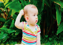 Little baby pulling onto mom's hair with a big smile baby pulling up to stand. Moma Baby Etc How To Deal With Hair Pulling In Babies