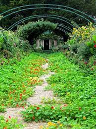 Monet S House At The End Of A Flower Filled Pathway In Giverny France Monet Garden Giverny Giverny Monet Giverny France