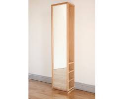 For those with a narrow entryway, consider arranging a floor mirror on a stand next to the console table. Full Length Mirror With Hanging Storage Futon Company