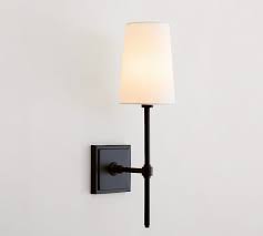 While the ideal height from the floor for a wall sconce depends on the height of your ceilings and size of the fixture, most wall sconces are installed with the center of the fixture between 60 inches and 72 inches. Pearson Shade Sconce Pottery Barn