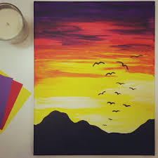 Since the sun is just about to disappear, the horizon is full of yellows, oranges and reds. An Acrylic Painting Of The Sunset Using A Warm Color Palette Painting