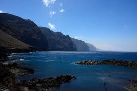 You look so wonderful in your dress you look so beautiful in this light your silhouette over me the way it brings out the blue in your eyes it's the tenerife sea. Hd Wallpaper Spain Tenerife Sea Blue Cliff Acantilado Water Scenics Nature Wallpaper Flare