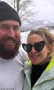 Kate Hudson shares a quick kiss and lots of smiles with her fiancé Danny  Fujikawa