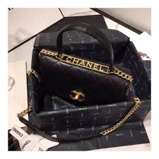 This mini coco handle flap bag is of light pink caviar with light gold tone hardware and has the signature diamond quilting in a trapezoidal shape with signature cc interlocking closure, top handle, and long light gold. Chanel Flap Bag With Top Handle As1174