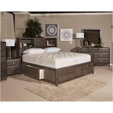 Wooden king size bed with 2 nights stands and wooden armor television set. B476 65 Ashley Furniture Caitbrook Bedroom Queen Storage Bed
