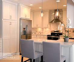 The gray counter tops compliment the cabinets and subway tile backsplash nicely. White Shaker Kitchen Cabinets Homecrest Cabinetry
