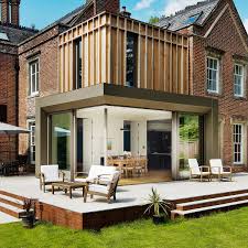 Upstairs, two new bedrooms were created. Traditional British Home In Brick Gets Fabulous Modern Extensions In Wood