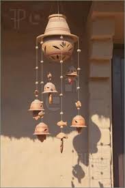 House Decor A Decorative Ceramic Wind Chime With Leaf Design Hanging From A Sunlit Doorway Wind Chimes Ceramic Decor Chimes