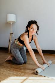 Download Premium Image Of Sporty Woman Rolling A Yoga Mat 1210043 Savasana Pose Yoga Yoga Mat