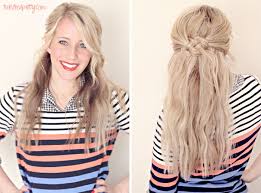 Hair is messily pulled back at the crown and tied there for some extra volume. 25 Gorgeous Half Up Half Down Hairstyles To Try Today