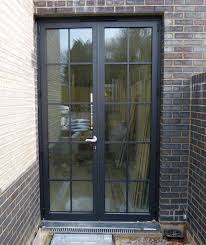 Skinny walnut door with brass hardware. Best Exterior House With French Doors 25 French Doors Exterior Aluminium French Doors French Doors Patio