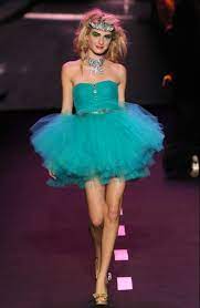 The models danced rather than walked down the runway wearing fearless styles and but we also saw some really fun sophisticated looks and chic seventies dresses that could be worn right off the runway! Betsey Johnson Pow Poof Pink Cocktail Party Dress