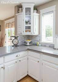 Soft gray tile and modern quartz countertops bring a clean, bright space for this family to enjoy. White Kitchen Reveal White Kitchen Makeover Kitchen Remodel Home Kitchens