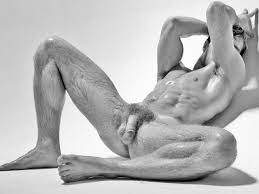 Naked guy poses