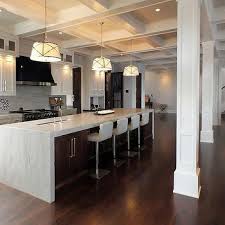Make a kitchen island do triple duty as a breakfast nook, food prep station and storage space with open shelving on the sides. Kitchen With Yellow Accents Contemporary Kitchen Morgan Harrison Home