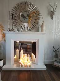 Living Room Apartment Custom Faux Mirror Fireplace With Candles With Sun Burst Silver Mi With Images Apartment Decorating Livingroom Fireplace Mantel Decor Fireplace Decor