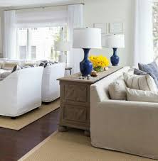 Sofa Not Against The Wall With A Piece Of Furniture Behind It I Love That It Has Lamps On Long Living Room Design Large Living Room Layout Long Living Room