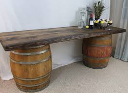 The whiskey barrel table is built from an authentic oak barrel topped with quartersawn oak wood with a clear glass center so you can see the barrel head. Feature Image Wine Barrel Furniture Wine Barrel Table Barrel Table