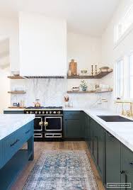 A Freestanding Hunter Green Island Is Fitted With A Shelf As Well As A Thick Gray And White Marble Coun Kitchen Trends Kitchen Interior Interior Design Kitchen