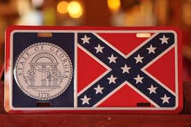 The georgia state flag has three red and white stripes, with the state coat of arms on a blue field in the upper left corner. The Real Georgia Flag License Plate