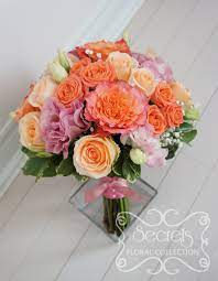 Ivory and light orange roses lavender roses are trendy and unusual. Fresh Two Tone Peach Garden Roses Free Spirit Peach Standard And Spray Roses Solid Pink And Bi Colour Pink Lisianthus And Baby S Breath Bridal Bouquet With Coral Pink Ribbon Wrap Front View Secrets Floral Collection