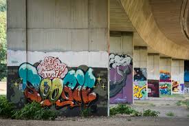 The singular graffito is rarely used except in archeology) is writing or drawings made on a wall or other surface, usually without permission and within public view. Open Bridge Stadt Lorrach
