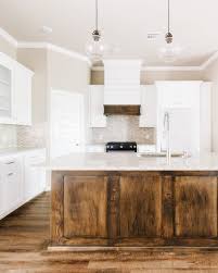 Modern White Rustic Kitchen With Dark Stained Island And Custom Shiplap Hood In 2021 Stained Kitchen Cabinets White Kitchen Rustic Rustic Kitchen
