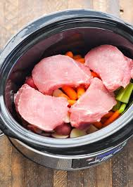 Remove the cooked pork chops from the slow cooker and set them aside on a plate. Slow Cooker Pork Chops With Vegetables And Gravy The Seasoned Mom