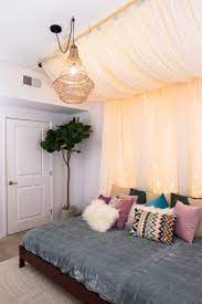 One idea is to decorate walls with custom posters using wooden slat frames. Charming But Cheap Bedroom Decorating Ideas The Budget Decorator