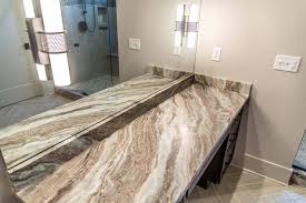 This granite has the perfect mix of shades of brown and gray that pop against the white background. Bathroom Marble Image Galleries For Inspiration