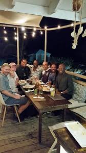 A stylish crowd sips potent cocktails on the pool deck with the deep blue sea as a backdrop. Eating Out Outdoor Deck At The Studio Cafe At Compass Point In The Bahamas Bild Von Studio Cafe New Providence Tripadvisor