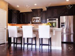 Wood cabinets with wood floors dark kitchen cabinets with light description. Modern Kitchen With Dark Wood Cabinets And Hardwood Floors Stock Photo Picture And Royalty Free Image Image 15079367